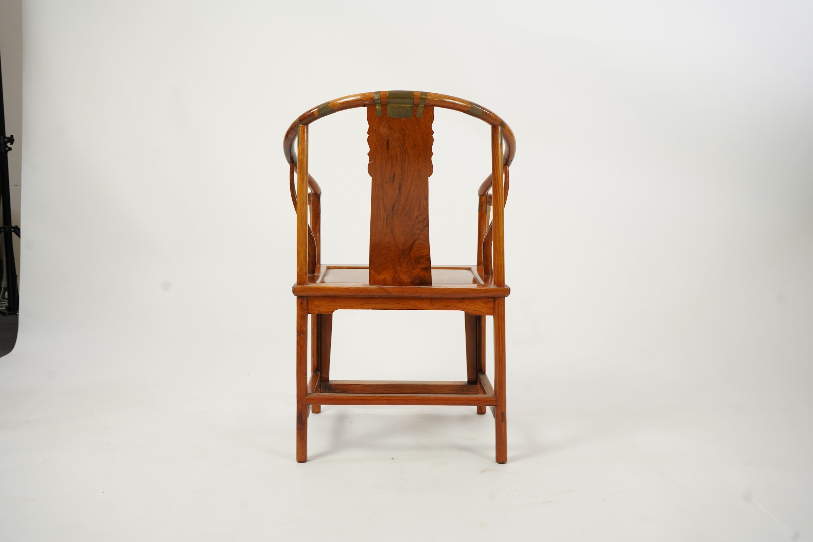 A Chinese huanghuali and brass mounted horseshoe-back armchair, quanyi, late 19th century